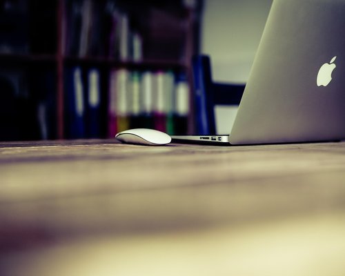 Person closing laptop after finishing work in a home office